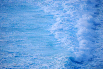 Blue sea marine ocean seascape tropical huge wave on blurred background. Seascape blue ocean white wave motion outdoor. Aqua marine huge wave sea summer background. Paradise turquoise water landscape