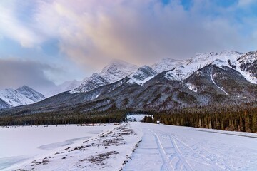Snowy Road Towards Canmore Mountains