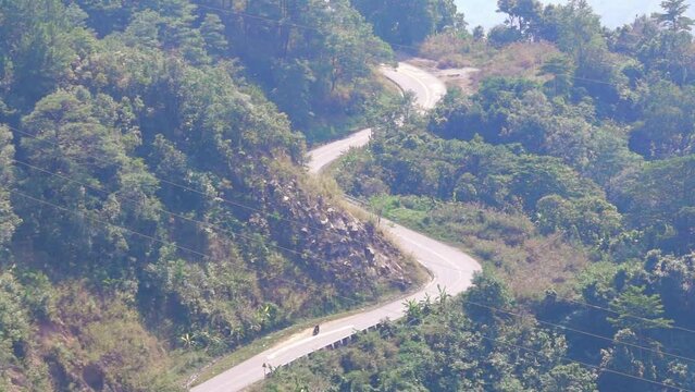 Traffic on a treacherous pass from above, connecting Ninh Thuan and Lam Dong provinces on a spring morning at Ngoan Muc Pass, Da Lat, Vietnam