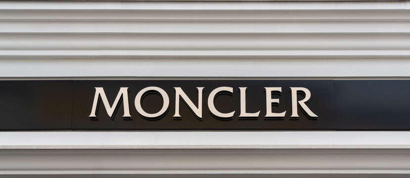 Vienna, Austria - December 10, 2022: Moncler store sign with gold letters