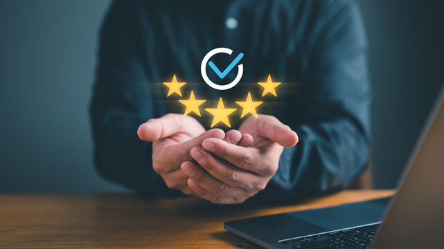 Businessman Hand shows the sign of the top service the best Quality assurance, Guarantee, Standards, ISO certification and standardization concept. guarantee product and ISO service concept.