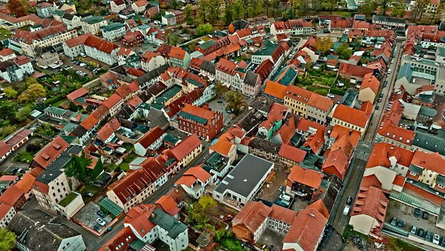 Aerial View Of a neighborhood in Haldensleben town, Saxony-Anhalt, Germany . Flying over houses and trees .