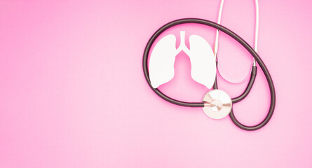 Lung symbol and a stethoscope are on a pink background