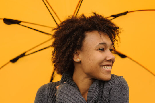 Outdoor Photo Of Young African American Woman With Yellow Umbrella