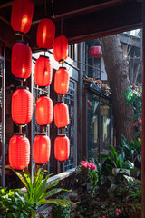 Red Chinese lantern hanging on an ancient Chinese house in Jinli ancient street, Chengdu, Sichuan province, China - 559647174