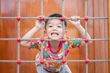 Asian Kids playing at playground outdoor with happy smile