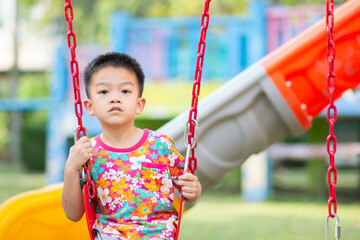 Asian Kids playing at playground outdoor with happy smile