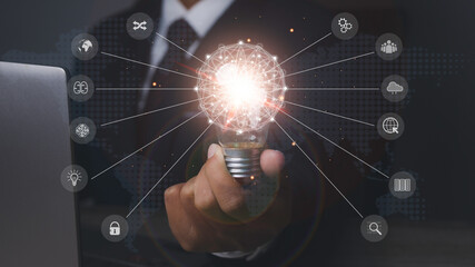 Businessman holding bright light bulb with icons of Idea, Brainstorm, Innovation