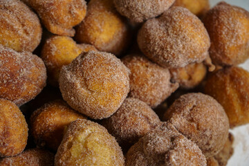 Brazilian traditional sweet raincake ( bolinho de Chuva ) served with sugar and cinnamon