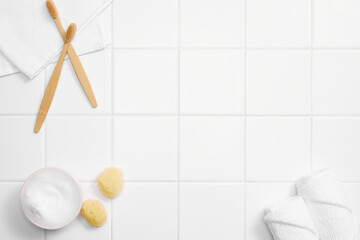 various bathroom objects on white tile, modern mood, top view and copy space