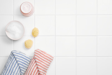 various bathroom objects on white tile, modern mood, top view and copy space