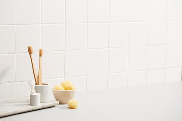 bathroom with white tile wall and bath objects. space for text, copy space