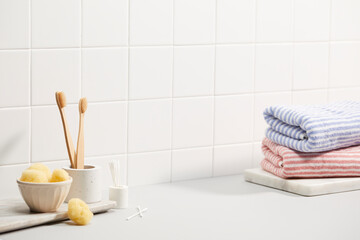 bathroom with white tile wall and bath objects. space for text, copy space