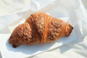 croissant on the white paper 