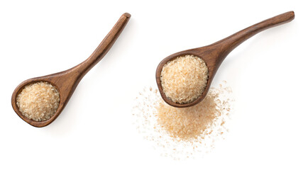 Psyllium husks in the wooden spoon, isolated on white background, top view.