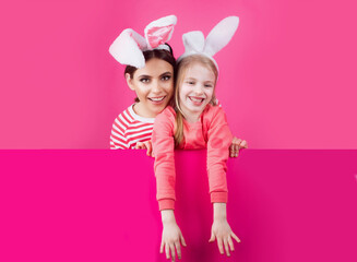 Fototapeta premium Happy childhood. Girls with bunny ears. Little sister kids celebrate easter. Egg hunt. Spring holiday.