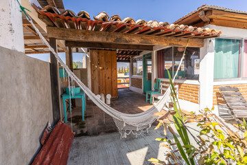 A wonderful open kitchen combined with a balcony and panoramic mountain views and a cozy hammock...
