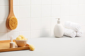 bathroom with white tile wall and bath objects. space for text, copy space