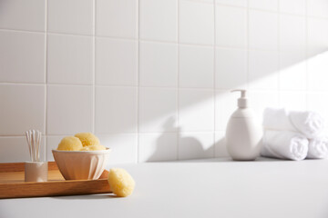bathroom with white tile wall and bath objects. space for text, copy space