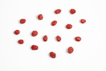 Red sugar coated peanuts or cacahuates garapiñados in white background