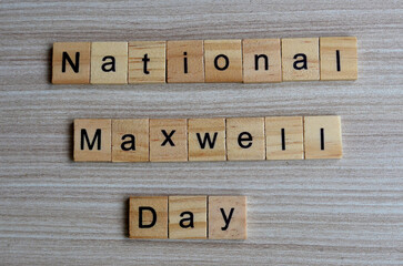 National Maxwell day text on wooden square, holiday concept quotes
