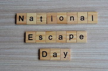 national escape day text on wooden square, education quotes