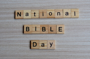National Bible day text on wooden square, holiday concept quotes