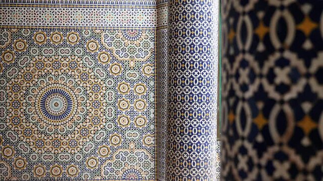 Moroccan zellige mosaic pattern in traditional Islamic geometric design in Morocco. Made with natural colors from indigo, saffron, mint, kohl. 4k Moroccan design background footage changing focus.
