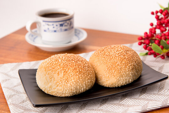 Kompyang bread or Kompia or Guang Bing, a typical Chinese bread that is popular in Indonesia, both filled with meat and empty. Its signature with a sprinkling of sesame on top