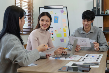 Young Asian Start up new business working at creative office. Modern start-up business team. Co-workers ui, ux startup small business