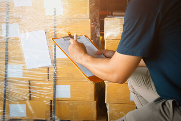 Workers Holding Clipboard is Checking Stock of Packaging Boxes. Cartons, Cardboard Boxes. Warehouse Inventory Management. Supply Chain. Shipment Boxes Shipping Warehouse Logistics.