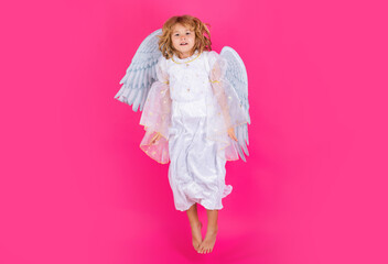 Angel child jump, kids jumping, full body in movement. Valentines day banner. Cute child with angel wings. Studio portrait of angel child on studio color isolated background with copy space.