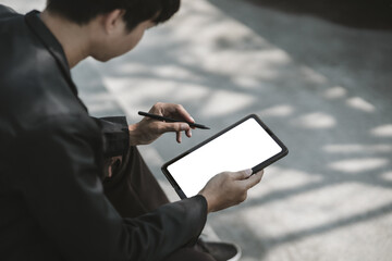 Employees fired or resigned from the company are using tablet to find a jobs..Unemployed, hiring job, quitting job concept.