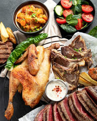 Various food. Meat dishes and vegetable dishes. Menu. Food on the plates.