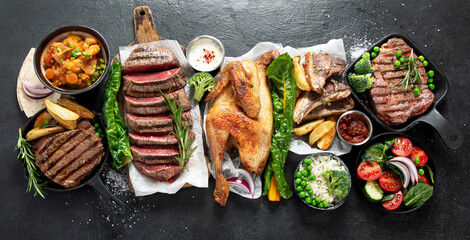 Various food. Meat dishes and vegetable dishes. Menu. Food on the plates.