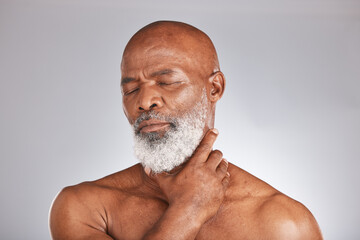 Senior black man, massage pain in spa on gray background or physical therapy care for healthy body....