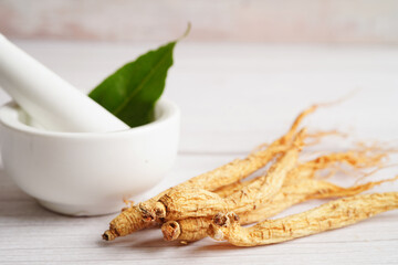Ginseng roots and green leaf, healthy food.