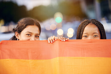 Love, pride flag and portrait of a lesbian couple at a LGBTQ, freedom or community parade in the...