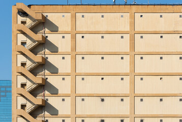 Staircase on exterior of high rise warehouse. Building abstract background