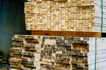 Stacked timber. Timbers ready for sale on the timber site. Withstanding timber.