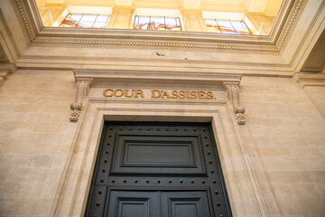 cour d'assises sign text on ancient wall interior building means in french assize court justice