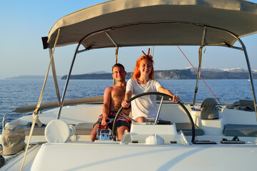 Woman sailing in the yacht on her honeymoon