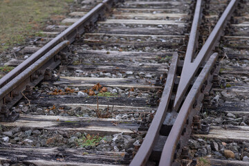 Detail of a heart of a railway switch or point. Part of train switch where tracks are held together. Old train switch.