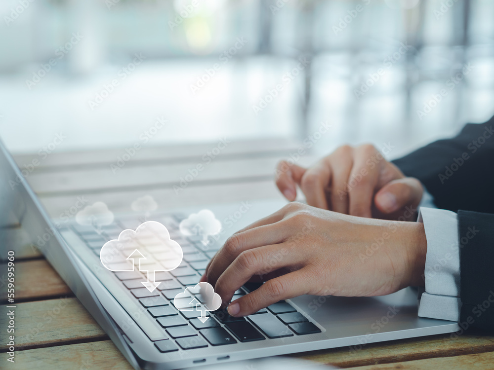 Poster cloud technology concept. small cloud icons appearing on laptop computer while business people worki