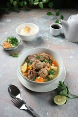 Meatball soup with meat, sliced ​​carrots and potatoes
