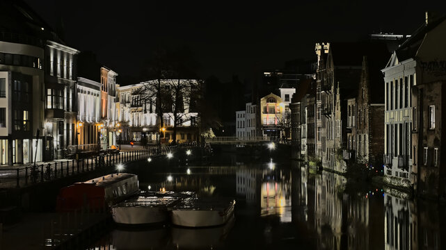 Historical buildings along river Lys in Ghent at night