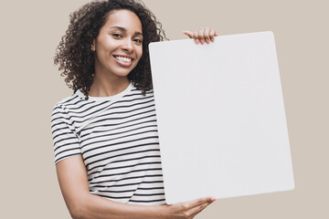 Happy young woman holding blank white banner sign, closeup isolated studio portrait