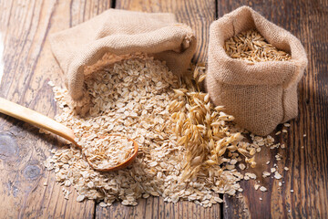 oatmeal flakes, grains and ears of oat