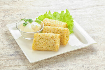 Stuffed pancakes with meat and cream