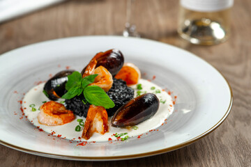 seafood, mussels, salmon on a white plate